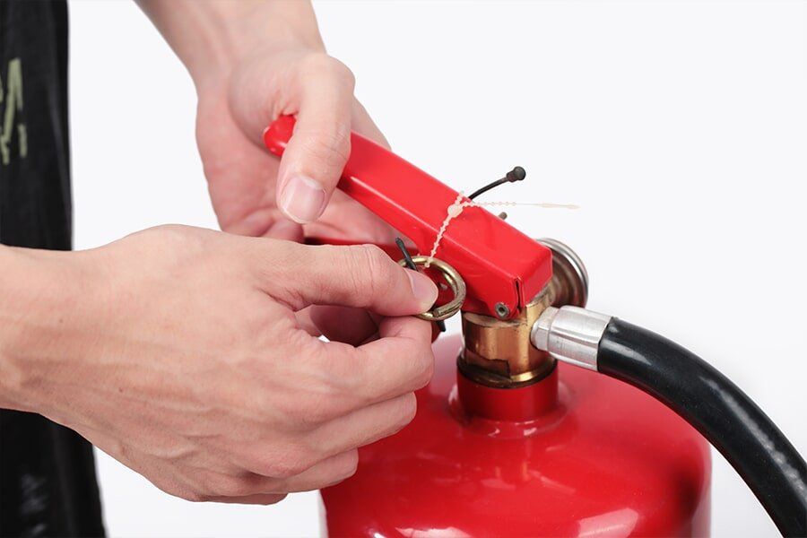 Tagging a Fire Extinguishers — East-West Fire Services In Garbutt, QLD