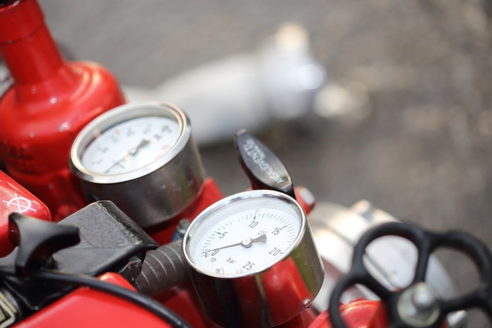 A Close Up of a Fire Extinguisher With a Bunch of Gauges on It — East-West Fire Services In Airlie Beach, QLD