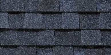 Dark blue asphalt roof shingles.