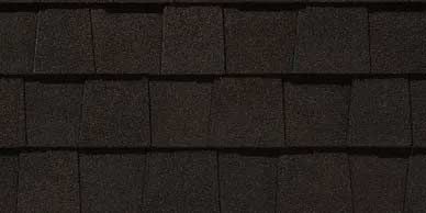 Close-up of dark brown asphalt roof shingles.