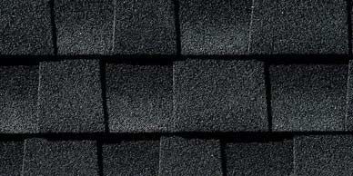 Close-up of dark gray asphalt roof shingles.