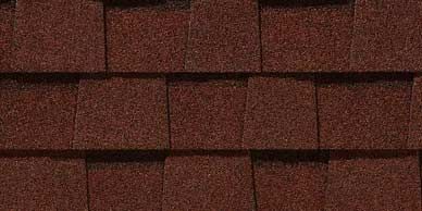 Close-up of dark brown asphalt roofing shingles.