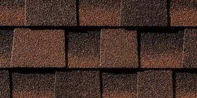Close-up view of brown and reddish-brown roof shingles.