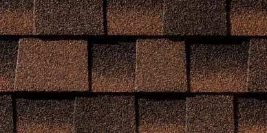 Close-up of brown and dark brown asphalt roof shingles.