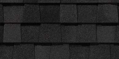 Close-up of dark gray asphalt roof shingles.