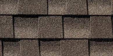Close-up of brown asphalt roof shingles.