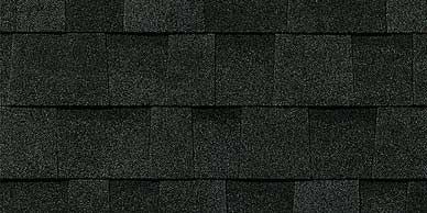 Close-up of dark gray asphalt roof shingles, arranged in a grid pattern.