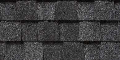Close-up of black asphalt roof shingles.