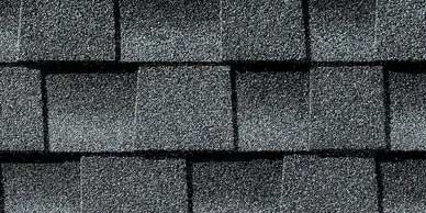 Close-up of dark gray asphalt roof shingles.