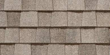 Close-up of gray and brown asphalt roof shingles.