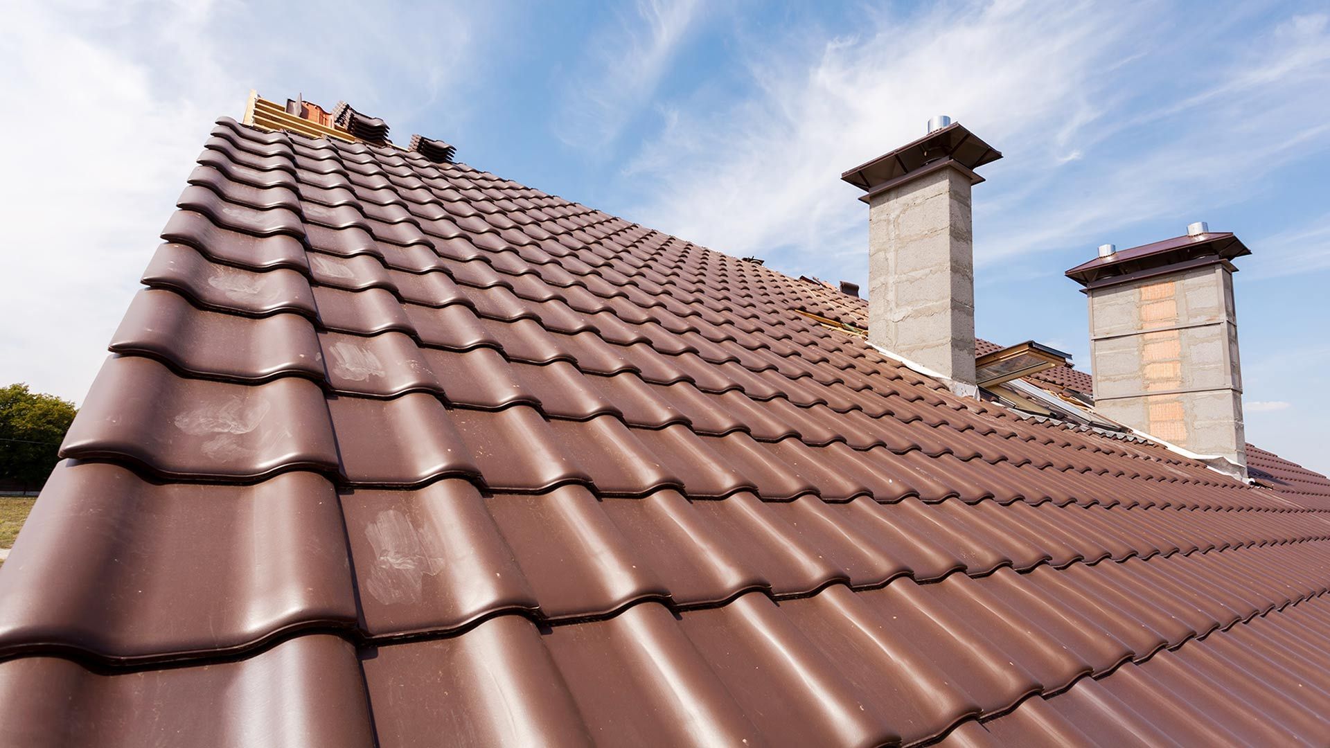 Homeowner inspecting roof shingles during routine roof inspections in Lawrenceville, NJ