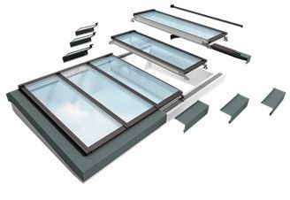 Overhead view of a rectangular skylight system showing components laid out for installation.