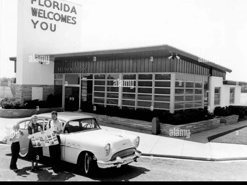 A black and white photo of a florida welcomes you sign