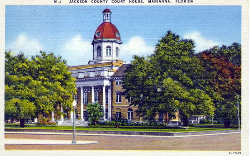 The jackson county courthouse in marianna florida is shown in a postcard