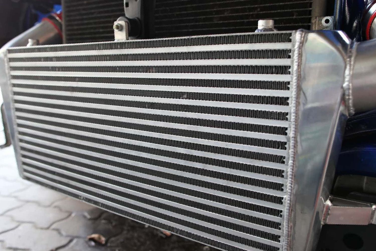 A Close Up of a Radiator on the Front of a Car — Fosters Ace Auto Repairs In Aitkenvale, QLD