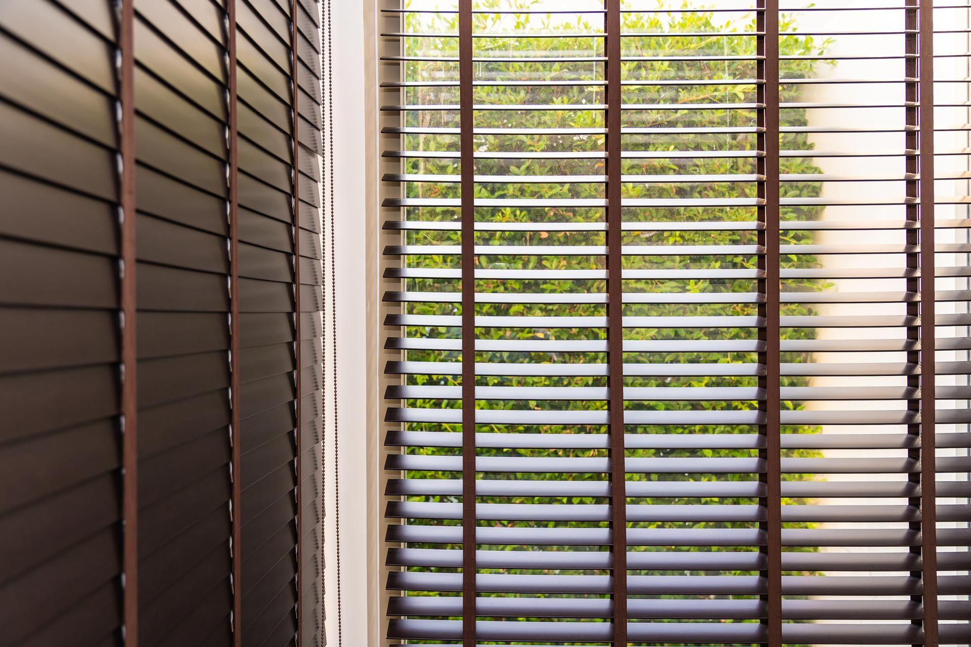 A close up of a window with shutters