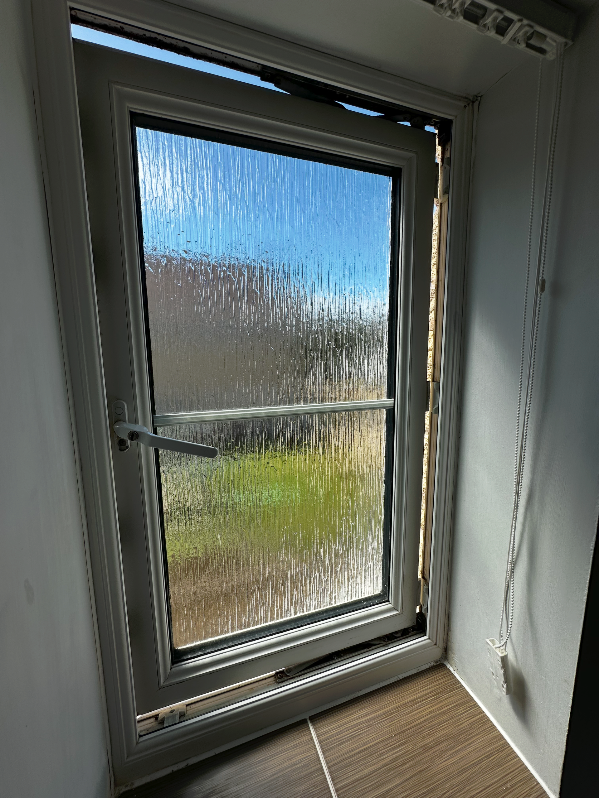 A Upvc Window with failed hinges.