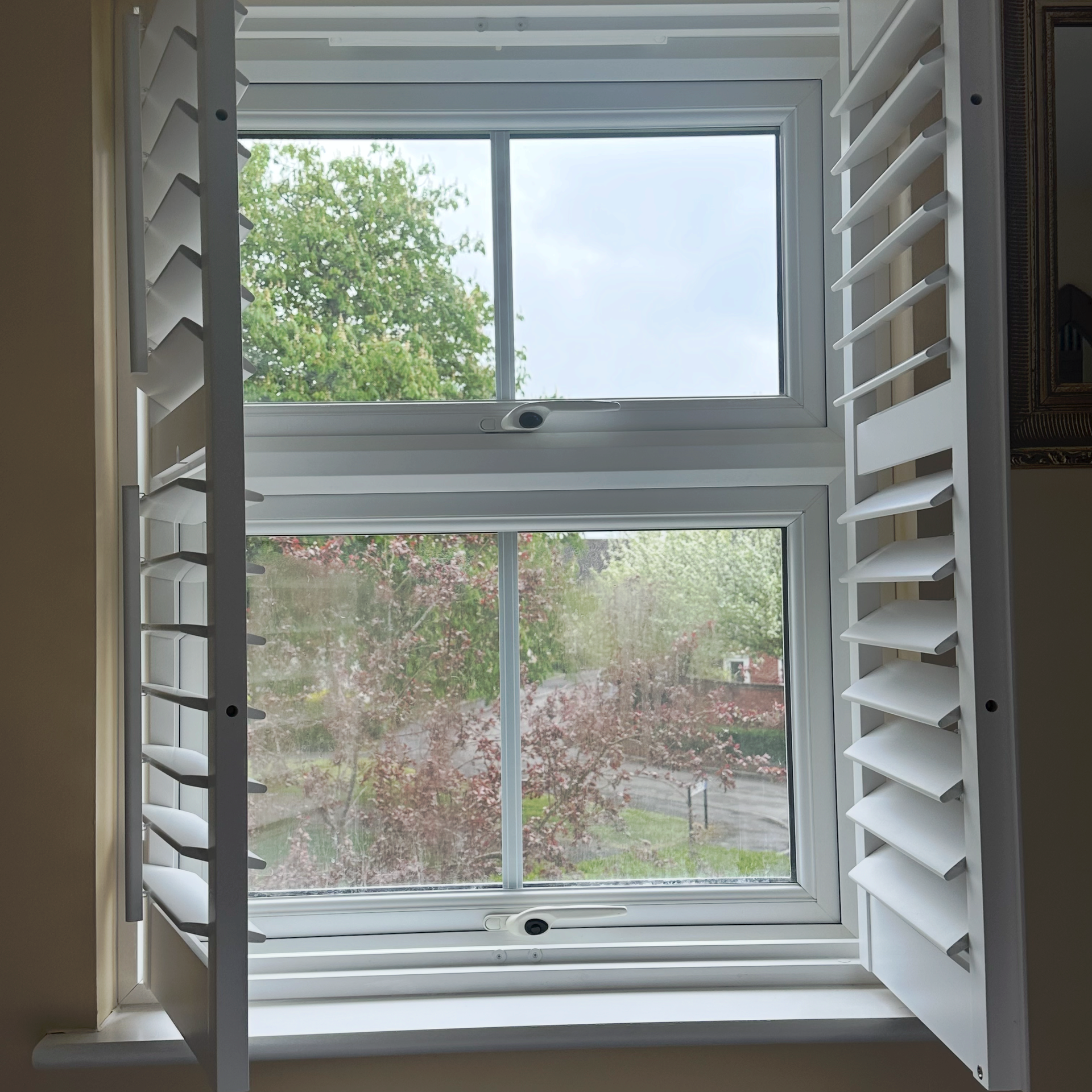 A UPVC window with a blown unit with internal condensation.