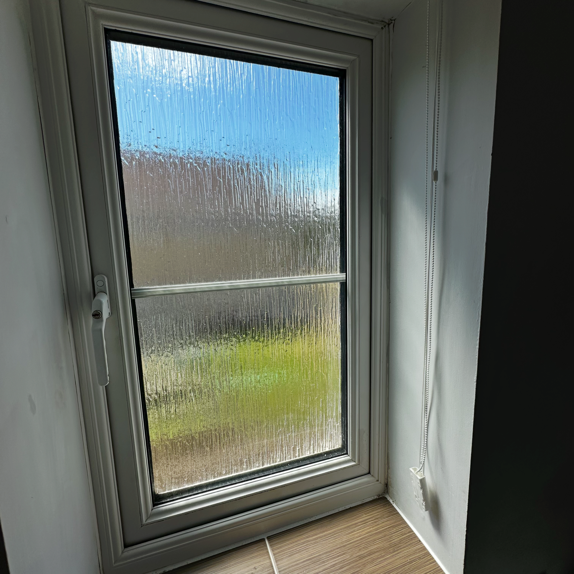 A Upvc window with repaired hinges.