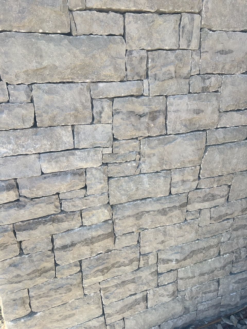 A brick wall with a lot of bricks on it