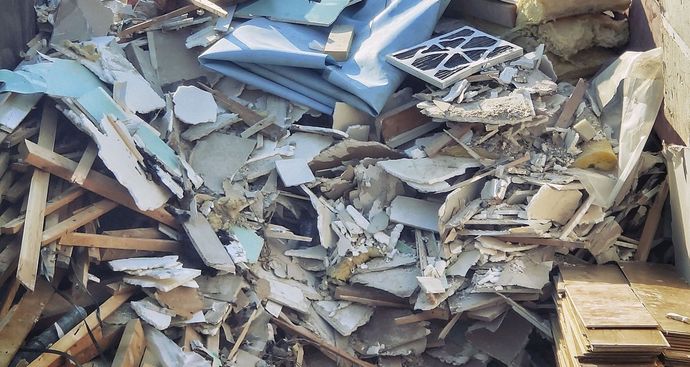 A pile of rubble is sitting on top of a wooden table.