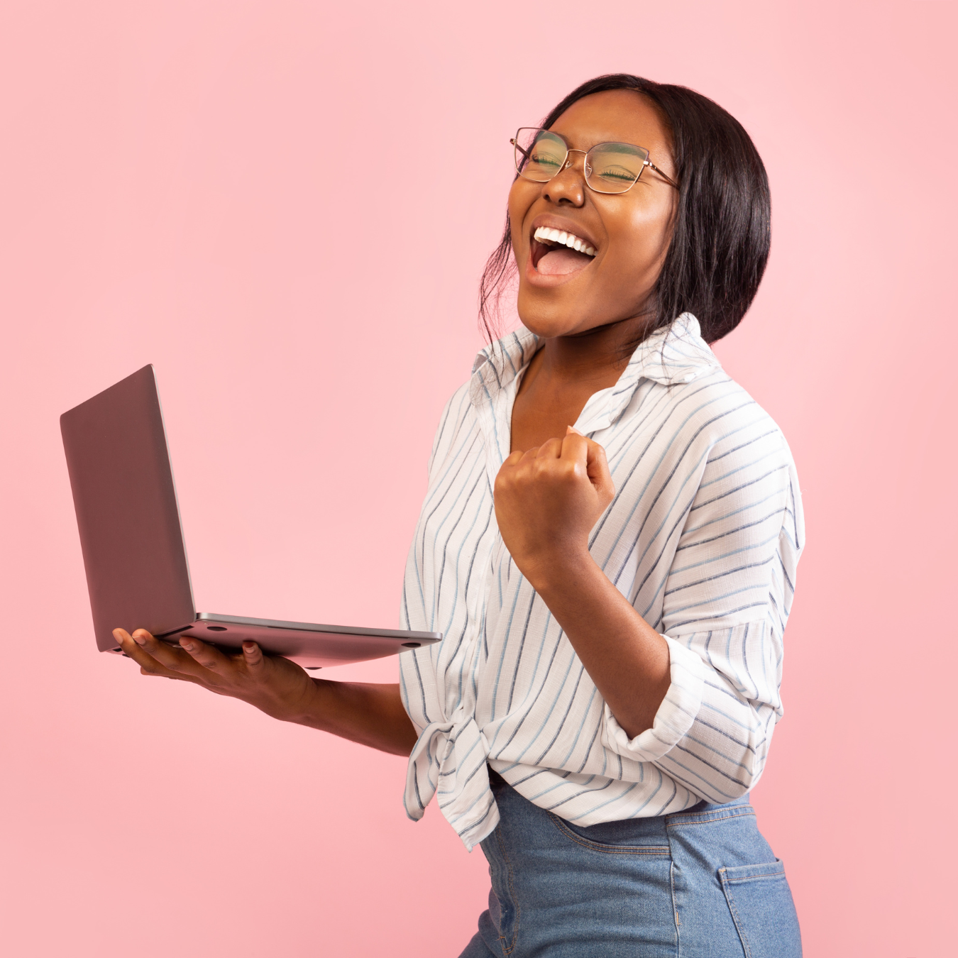 woman holding laptop