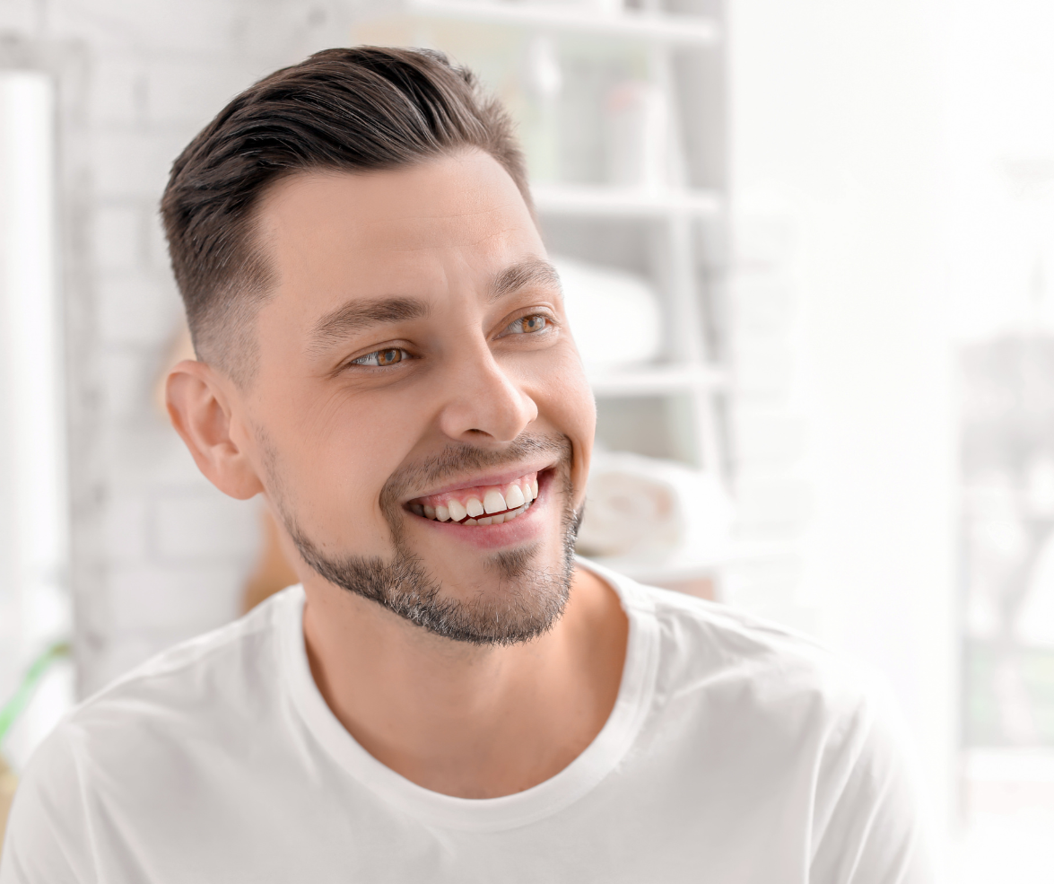 Smiling man with short dark hair