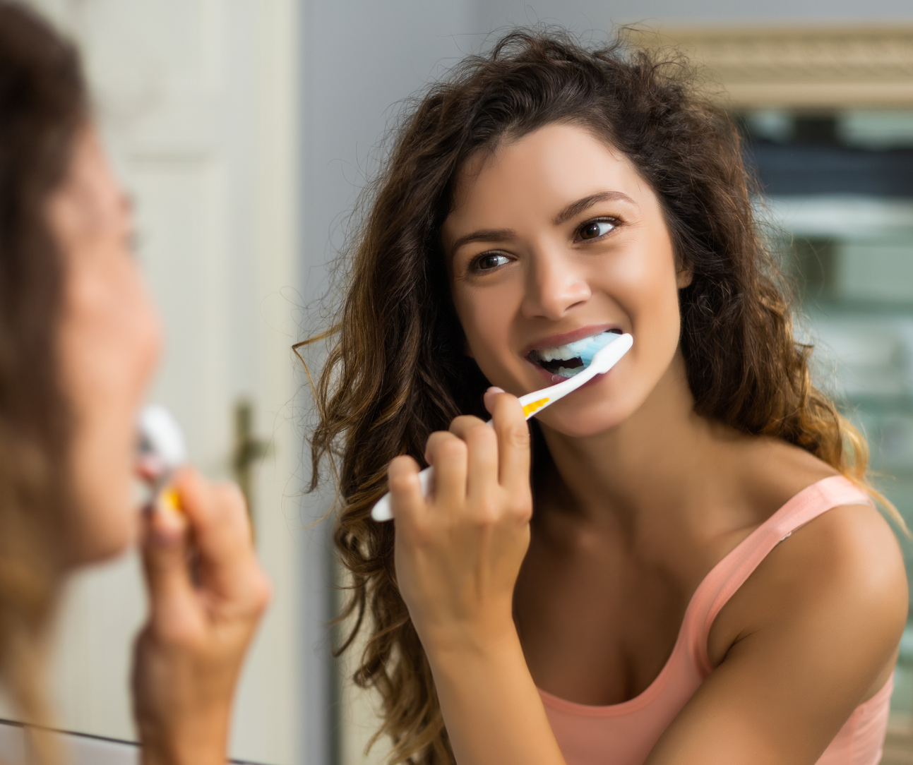 woman brushing teeth