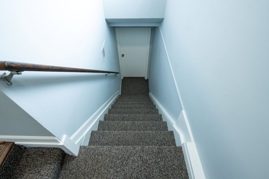 A set of stairs leading up to the second floor of a house.