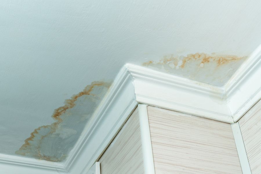 A ceiling with a lot of stains on it