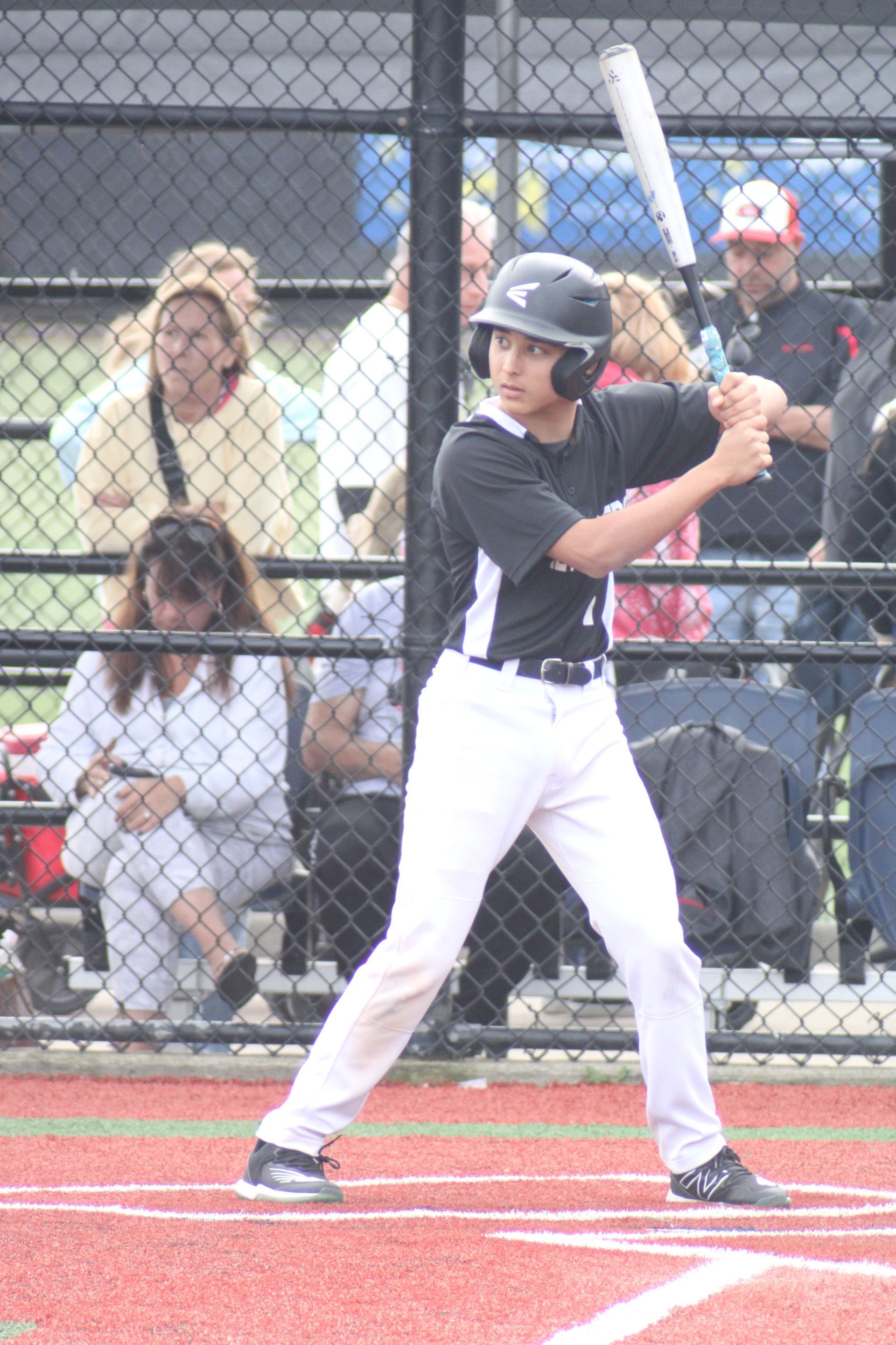 A baseball player is getting ready to hit the ball. Bret Hole @bretbaseball
