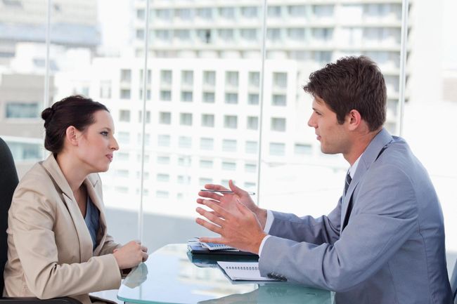 man discussing something to the woman