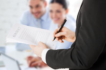 someone writing on the paper