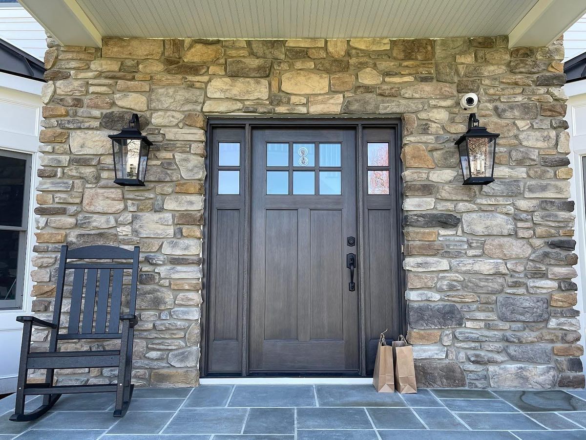 Entry door in a stone wall of home.
