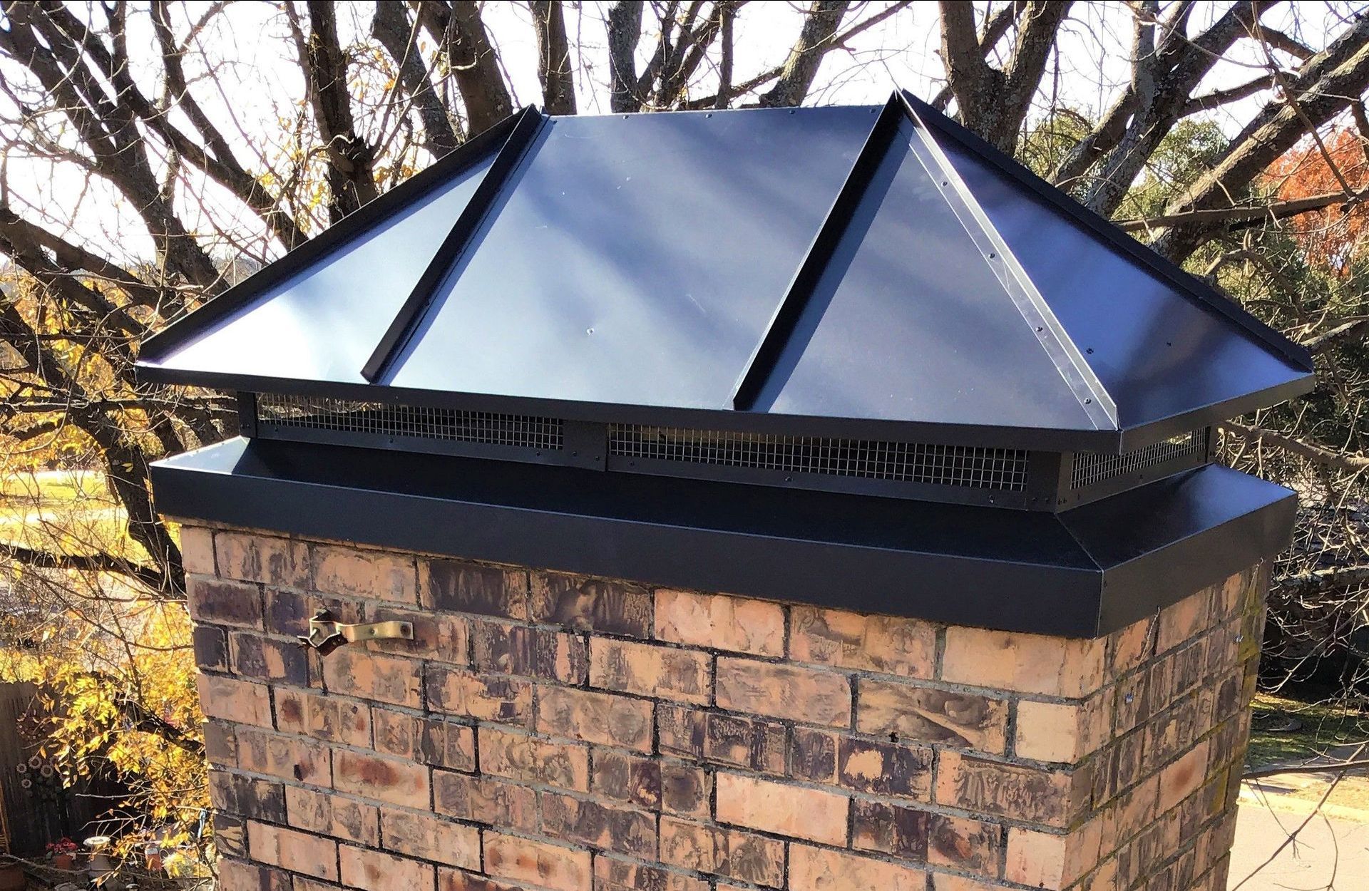 Hip style chimney cap
