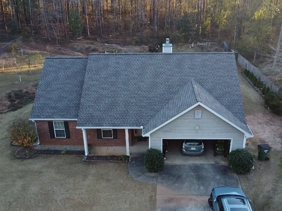 A normal sized house with a new roof