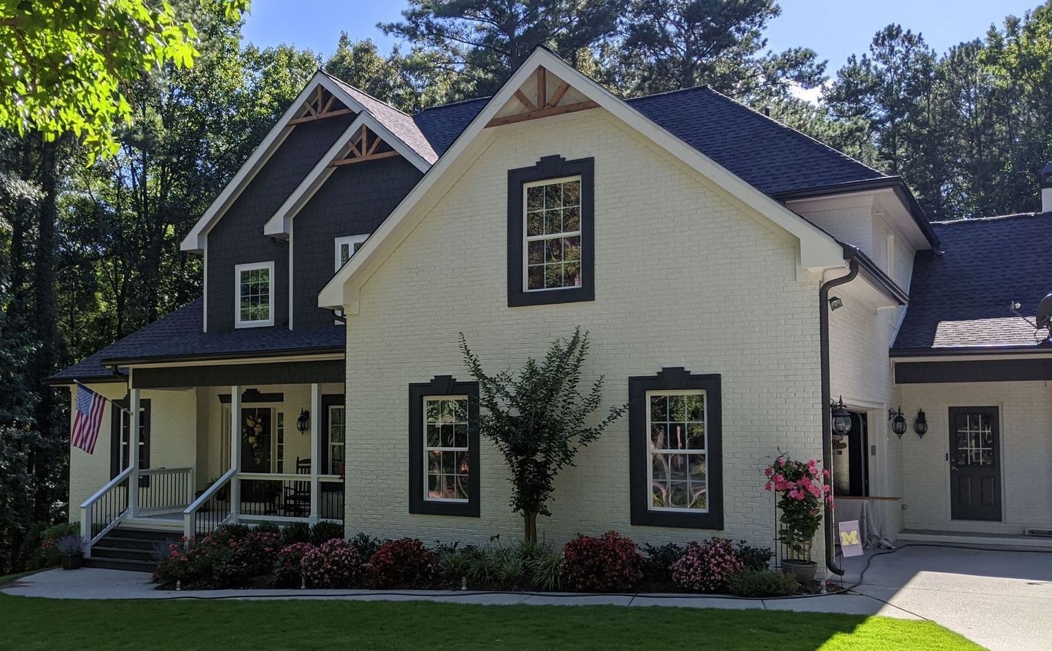 A large white house with a black roof