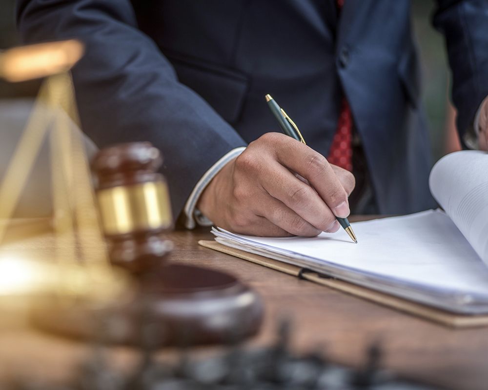 Man Signing Documents – Salem, MA –  Chris Drucas