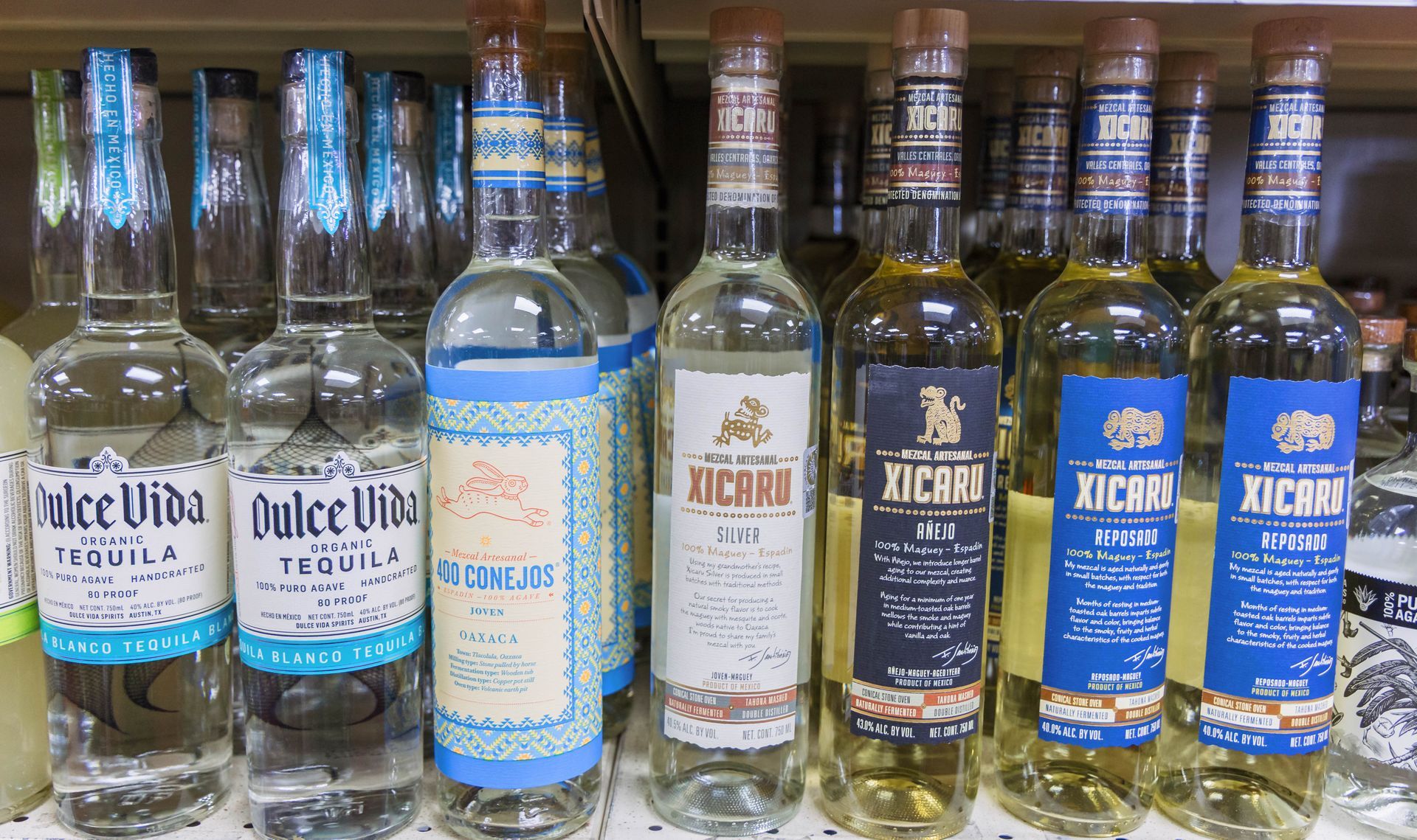 Tequila bottles on a shelf: