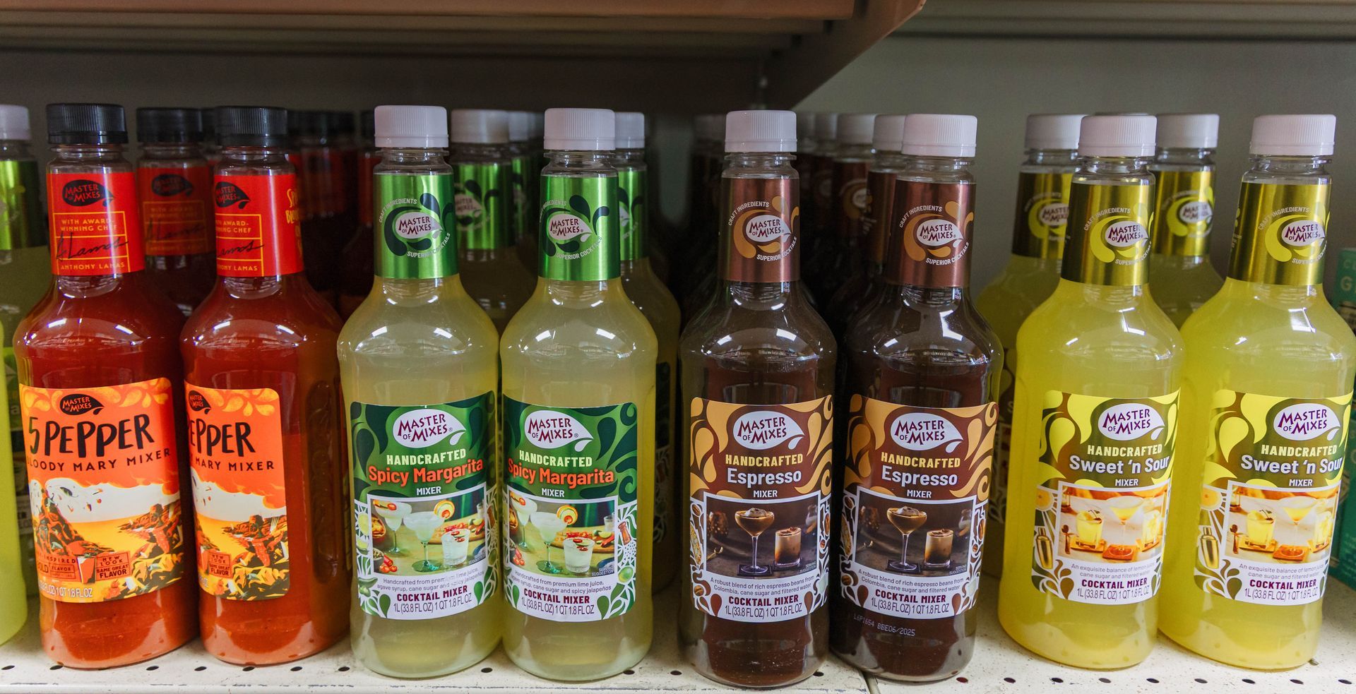 Bottles of various colorful drinks on a store shelf, including pepper, lime, and sweet tea flavors.