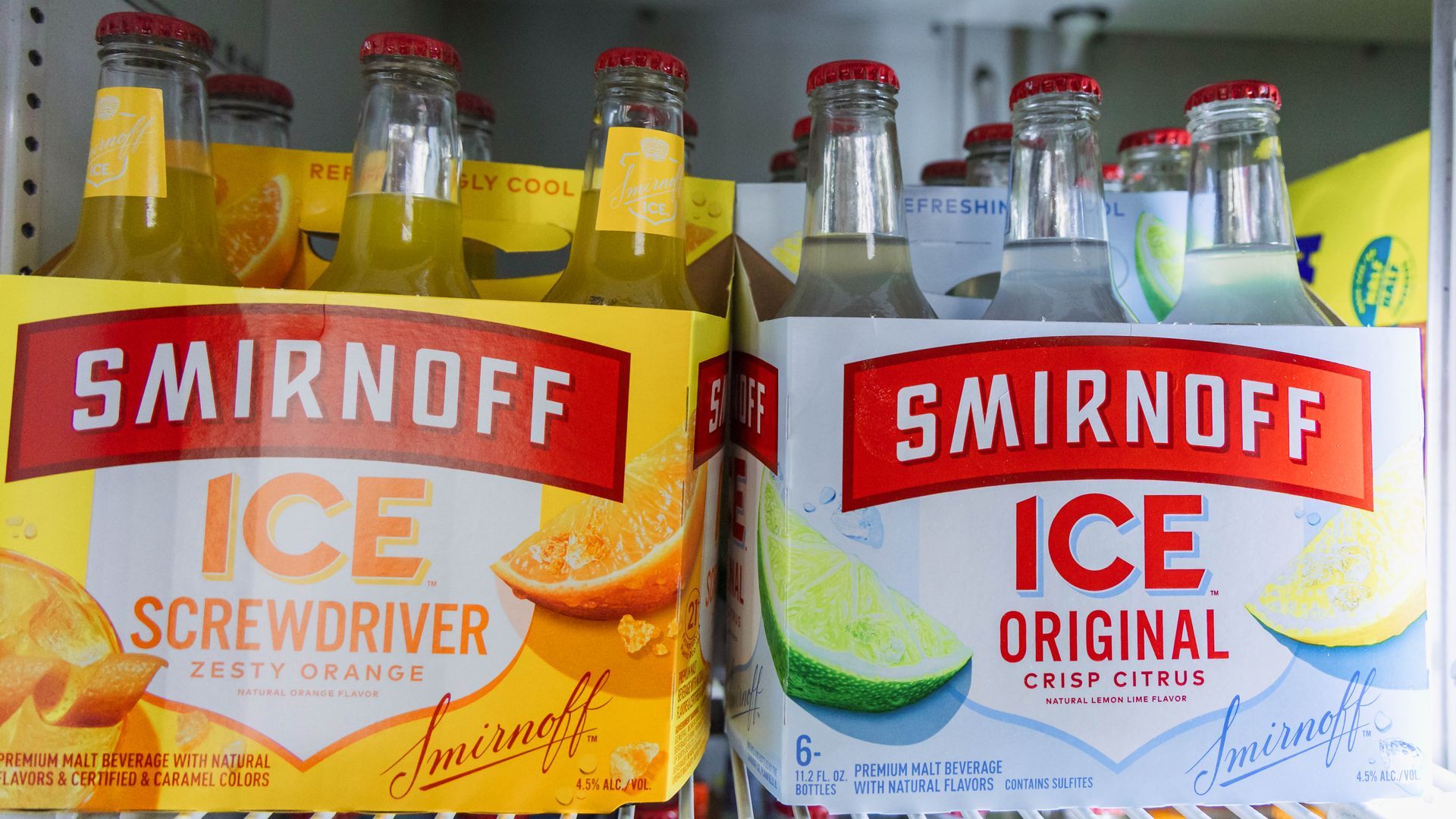 Smirnoff Ice in refrigerator. Orange screwdriver and original citrus flavors in a 6-pack.