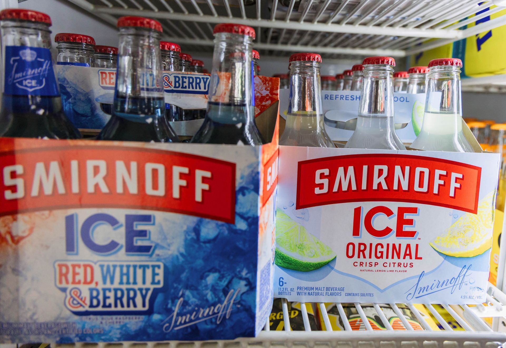 Smirnoff Ice in a refrigerator: Red, White & Berry and Original flavors in 6-packs.