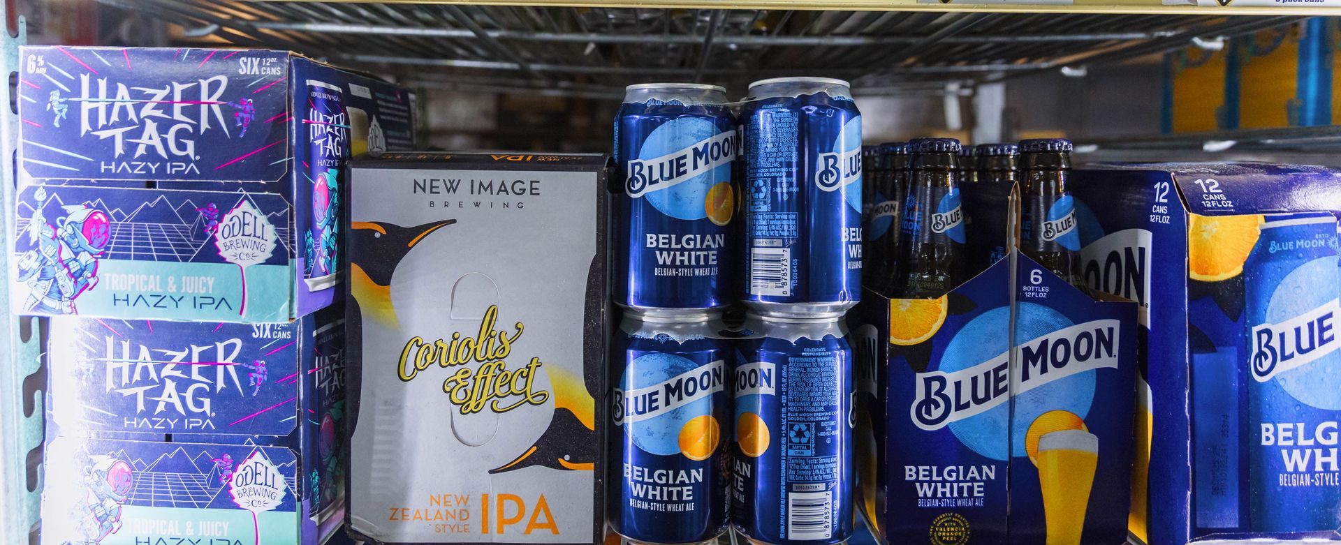 Beer selection in a cooler: Hazer Tag, Flying Dog IPA, and Blue Moon beers.