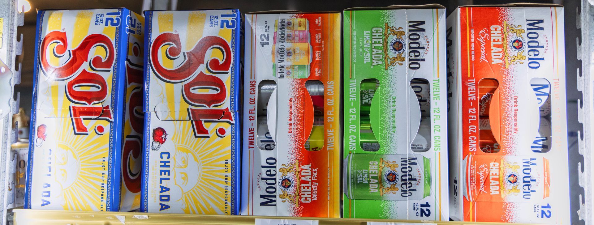 Cases of Sol and Modelo beer, stacked in a store.