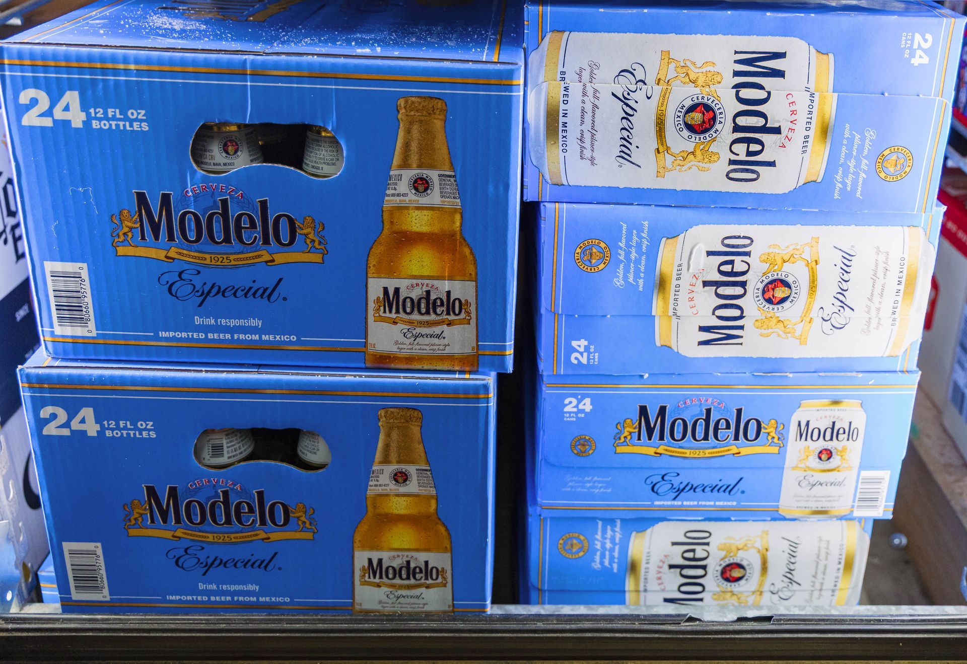Cases of Modelo Especial beer, stacked inside a cooler; blue boxes with gold and white labels.