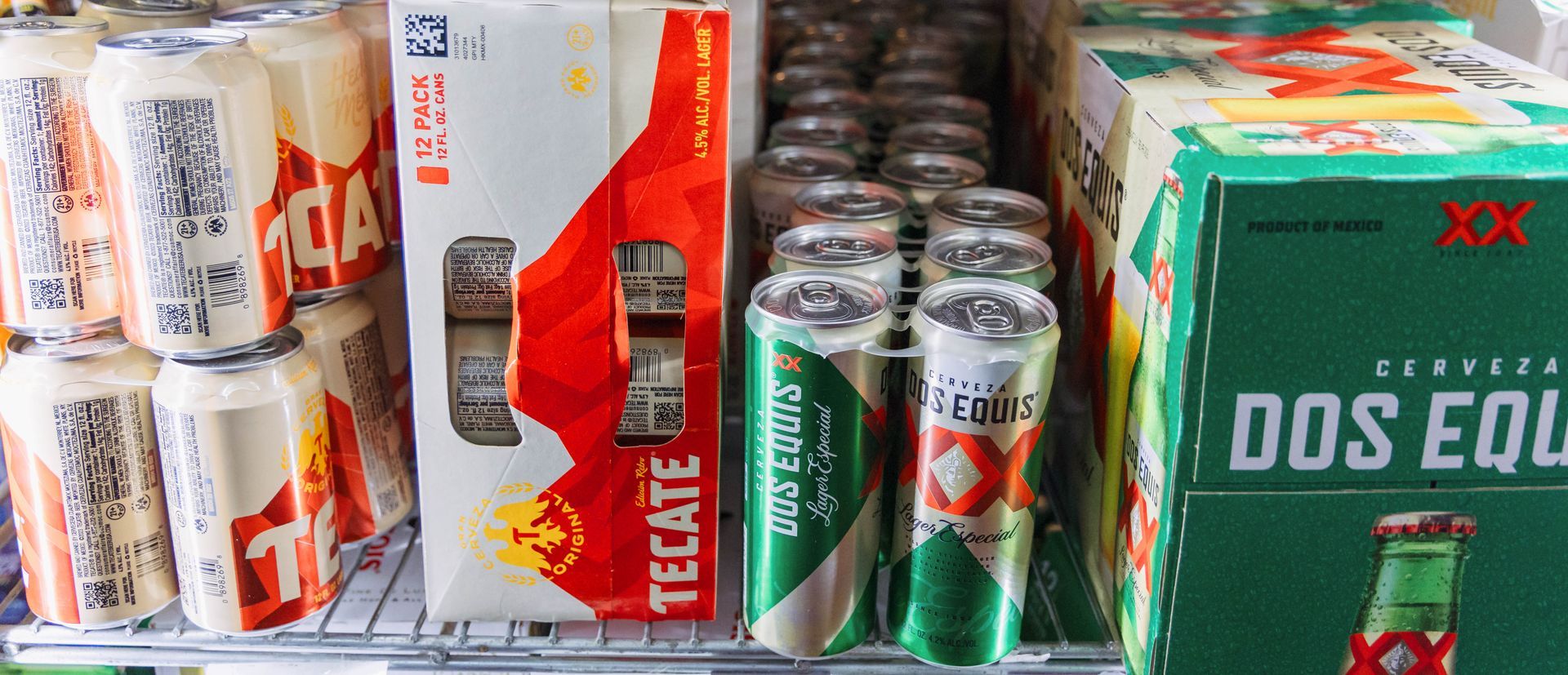 Beers in a refrigerator, various brands: Tecate, Dos Equis, and others.