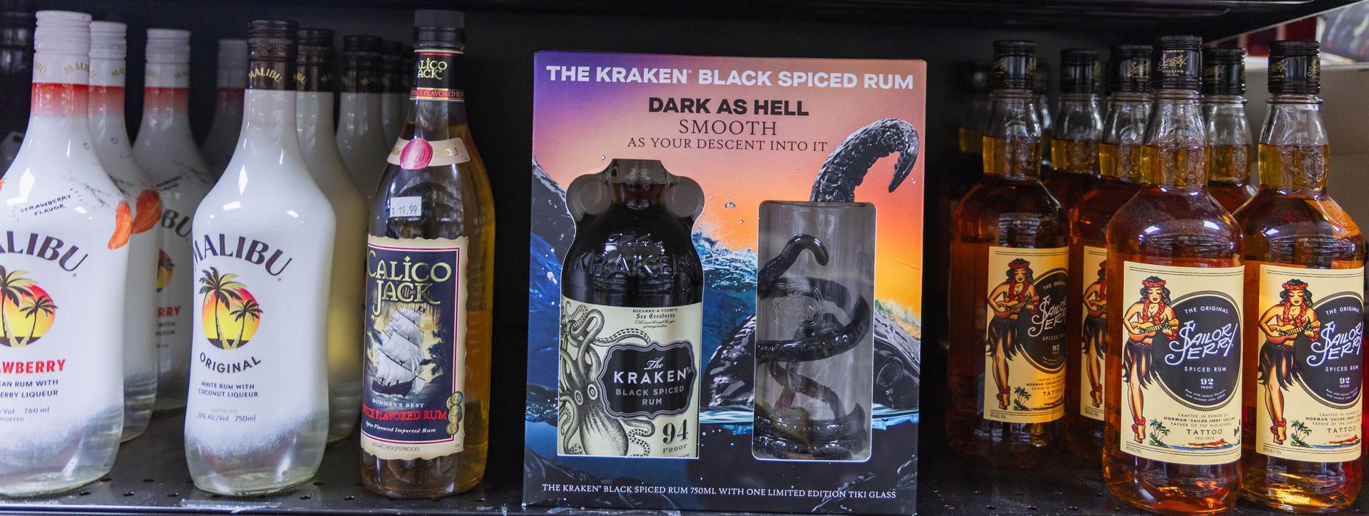 Bottles of liquor on shelves, including Malibu and