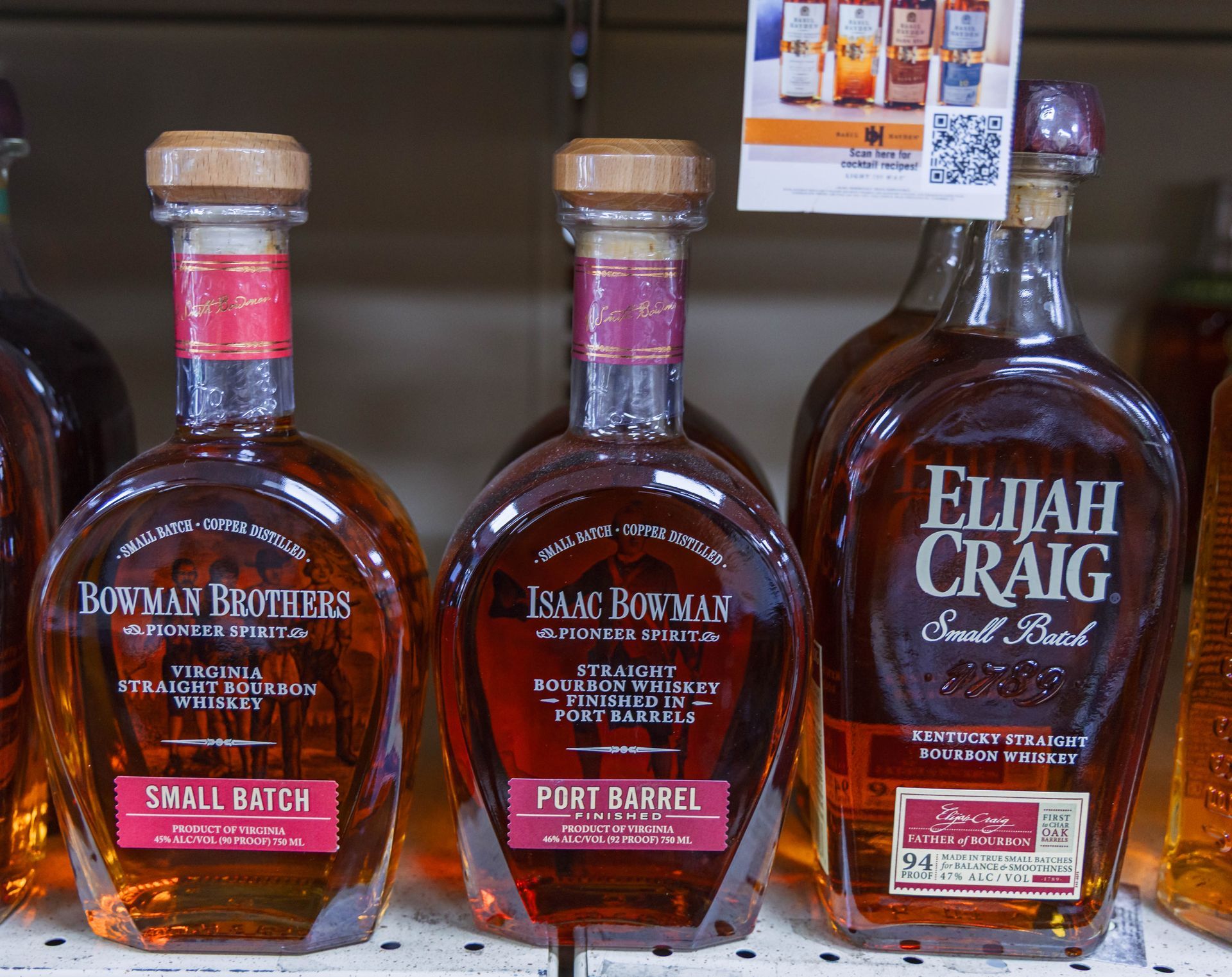 Bourbon bottles: Bowman Brothers, Isaac Bowman Port Barrel, and Elijah Craig Small Batch, in a liquor store.