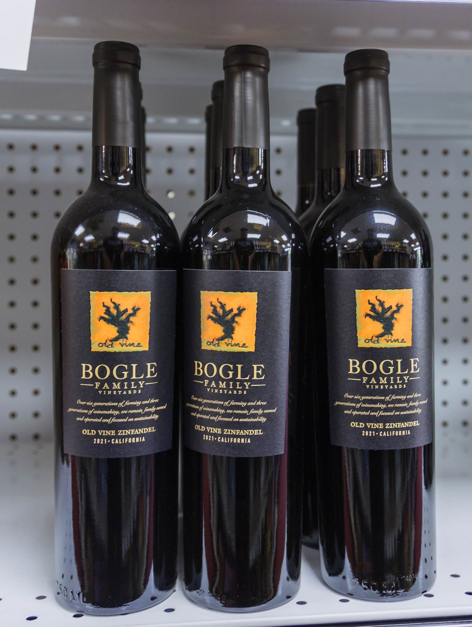 Bottles of Bogle Family Vineyards wine with dark labels on a store shelf.