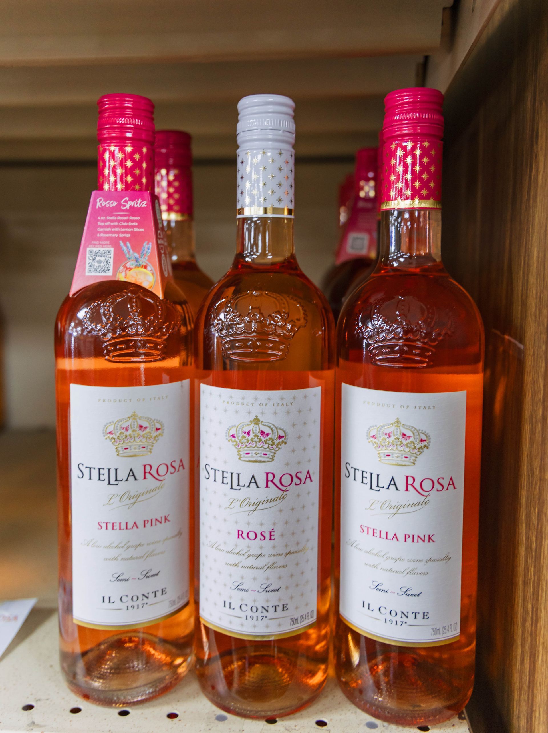 Stella Rosa rosé wine bottles on a shelf.